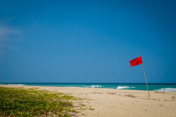 Red flag in the beach, Tayrona National Park, Colombia