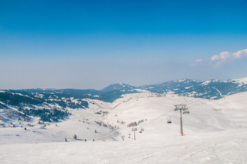 Ski lifts durings bright winter day