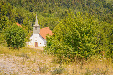 Old white chapel or a church in the mountains