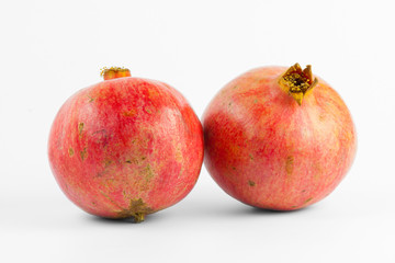 Ripe pomegranate isolated on white background