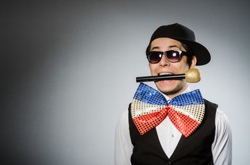Funny man with mic in karaoke concept