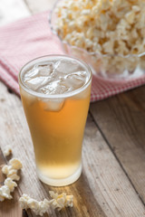 Glass beer with popcorn. Selective focus.