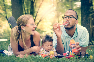 Happy Family in the park  in retro filter effect or instagram fi