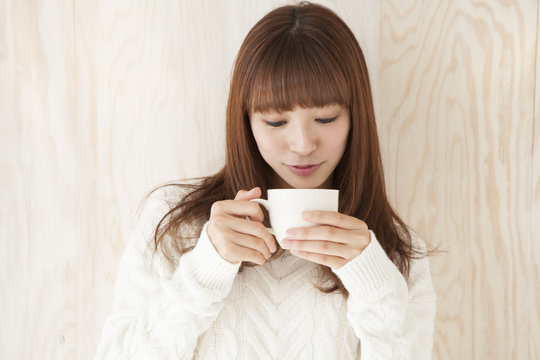 Young women are drinking hot drinks