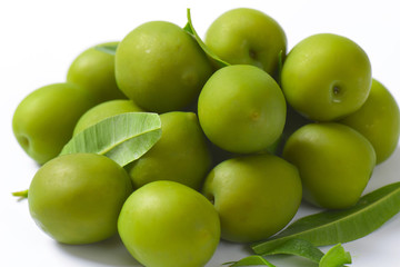 Fresh green olives on white background