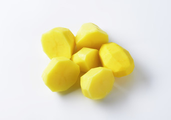 Halved peeled potatoes
