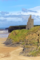 Fototapeta premium Ruined castle on a cliffs of Ballybunion on the wild atlantic way in county Kerry Ireland