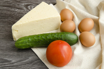 Cheese, eggs, cucumber and tomato