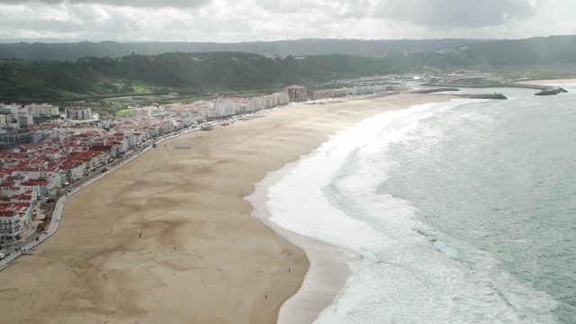 ow Season at the Beach with Waves in Nazare, Portugal