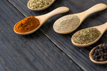 Spices and herbs in  bowls.