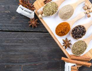 Spices and herbs in  bowls.