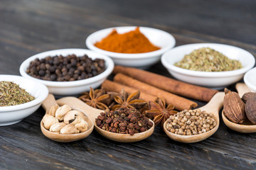 Spices and herbs in  bowls.