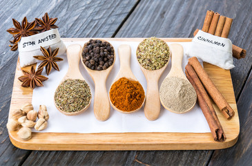 Spices and herbs in  bowls.