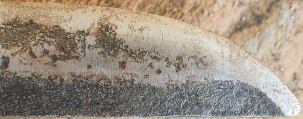 Part of an old damaged steel blade