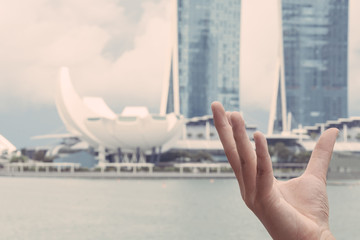 Hand like the ArtScience Museum in the foreground.