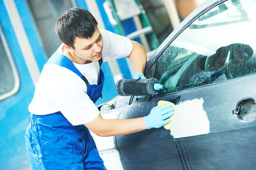 worker applying car  polish