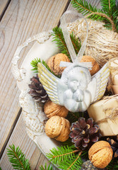 toys for the Christmas tree and pine cones on old wooden background