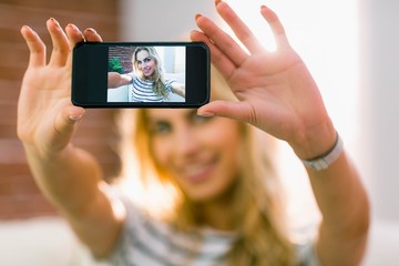 Pretty blonde taking a selfie