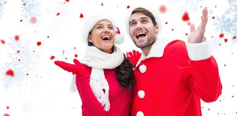 Composite image of festive young couple