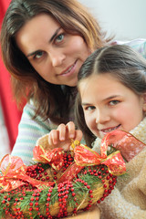 Happy young family getting ready for the Advent, Christmas holid