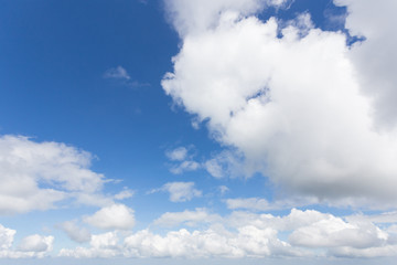 White clouds on the blue sky.