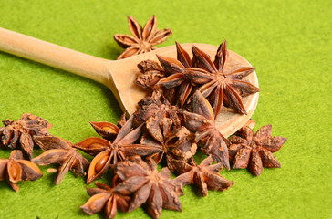asterisk on wooden spoon with green background (soft focus , lens blur)