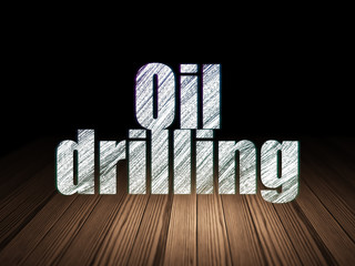 Industry concept: Oil Drilling in grunge dark room
