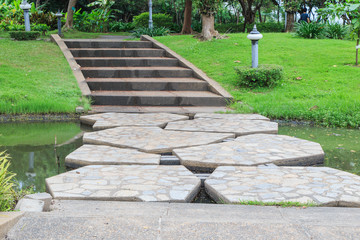 Beautiful stone bridge across the lake in Sirikit park Bangkok Thailand