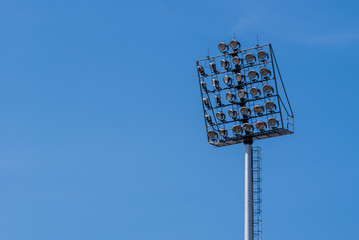 Spotlight with blue sky at stadium