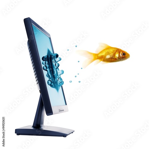 "fish jumping from The Flat panel lcd computer monitor" Stock photo and