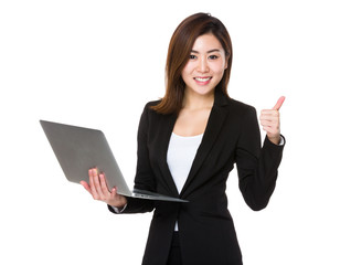 Asian Businesswoman hold with laptop computer and thumb up