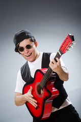 Funny guitar player in musical concept