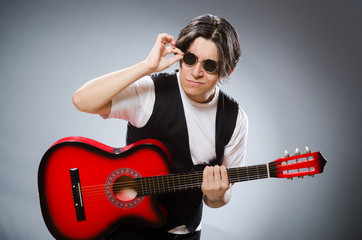 Funny guitar player in musical concept