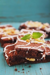 chocolate brownie cake with nuts and icing