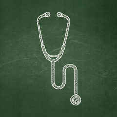 Fototapeta na wymiar Health concept: Stethoscope on chalkboard background