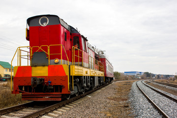 Obraz premium red-yellow locomotive train on the tracks