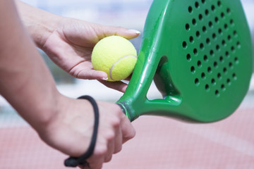girl paddle player ready for serve.