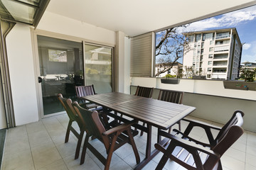 
cozy courtyard with furniture for outdoor recreation , with barbecue .