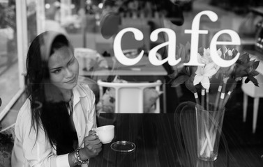 Young Asian woman in coffee shop