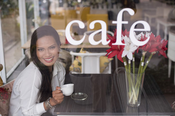 Young Asian woman in coffee shop