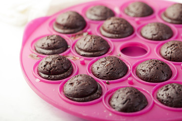Cake pops with chocolate glaze. Process of cooking and decorating