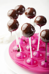 Cake pops with chocolate glaze. Process of cooking and decorating