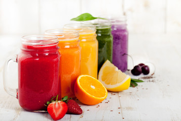 Fototapeta na wymiar Smoothies, juices, beverages, drinks variety with fresh fruits and berries.