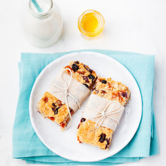 Oatmeal, oat bars with dried cranberry and raising . Healthy breakfast