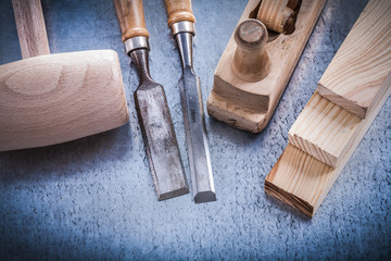Set of joinerâs tools on metallic background construction conc