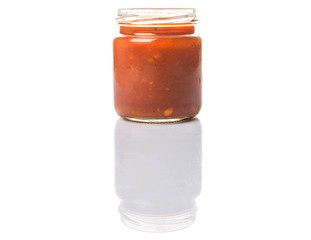 Spaghetti sauce in a mason jar over white background