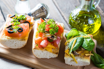 Italian appetizers, bruschetta with cheese and vegetables