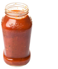 Spaghetti sauce in a glass bottle over white background