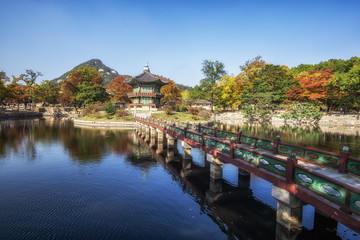hyangwonjeong autumn reflections and fall colors with lake reflections of the leaves surrounding the pavilion. Taken in Gyeongbokgung, South Korea. 