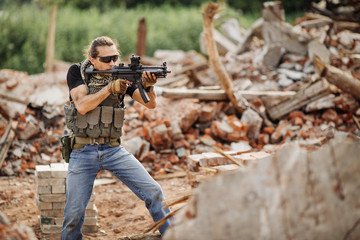 Private Military Contractor on patrol in destroyed city